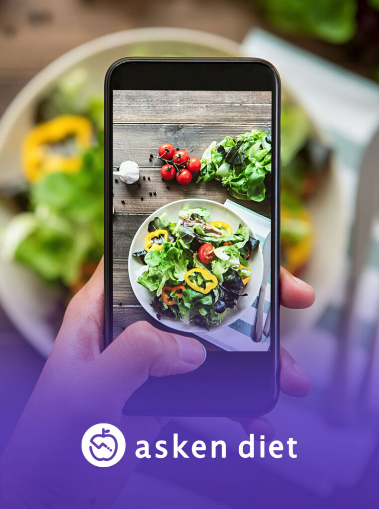 Smartphone photographing a fresh salad for Asken Diet food tracking app
